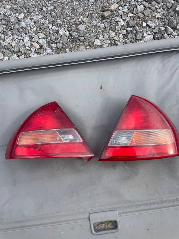 Ліхтарі задні пара стопи Mitsubishi Lancer Carisma лівий правий фонарь